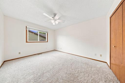 Comfortable main-level bedroom with large closet and natural light.