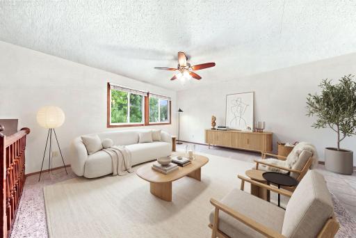 Light-filled living room offering plenty of space for relaxing or entertaining. - virtually staged
