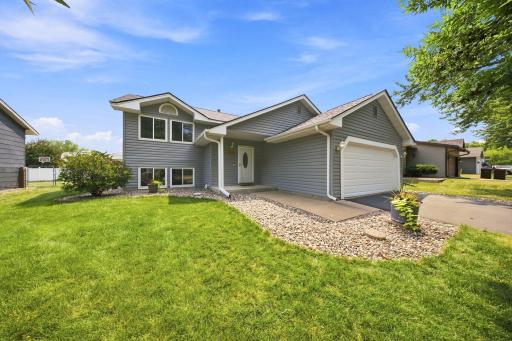 Welcome home! Attractive split-entry with great curb appeal, low-maintenance landscaping, and an attached two-car garage.