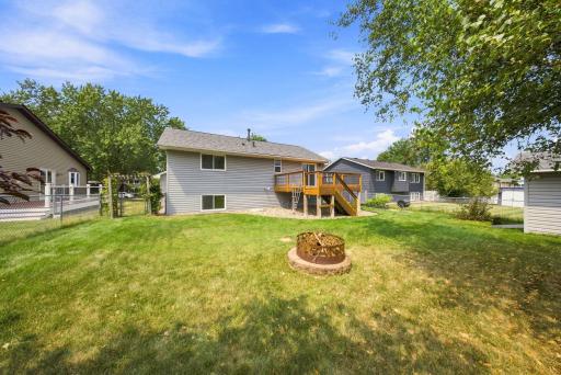 Relax around the fire pit, entertain on the deck, or enjoy the privacy of this spacious backyard.