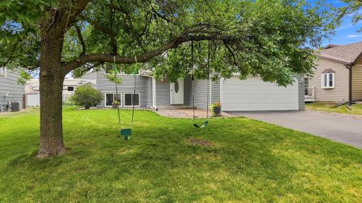 Welcome home! Attractive curb appeal, mature shade trees, and an attached two-car garage create a warm first impression.