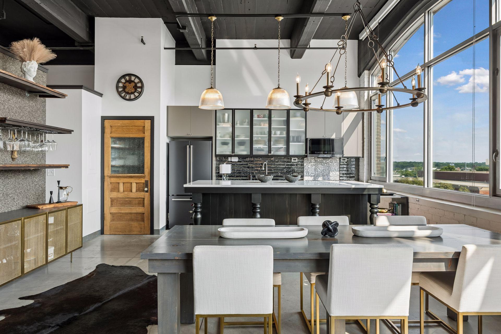 To the left of the refrigerator, a salvaged pantry door introduces character and a subtle architectural focal point.