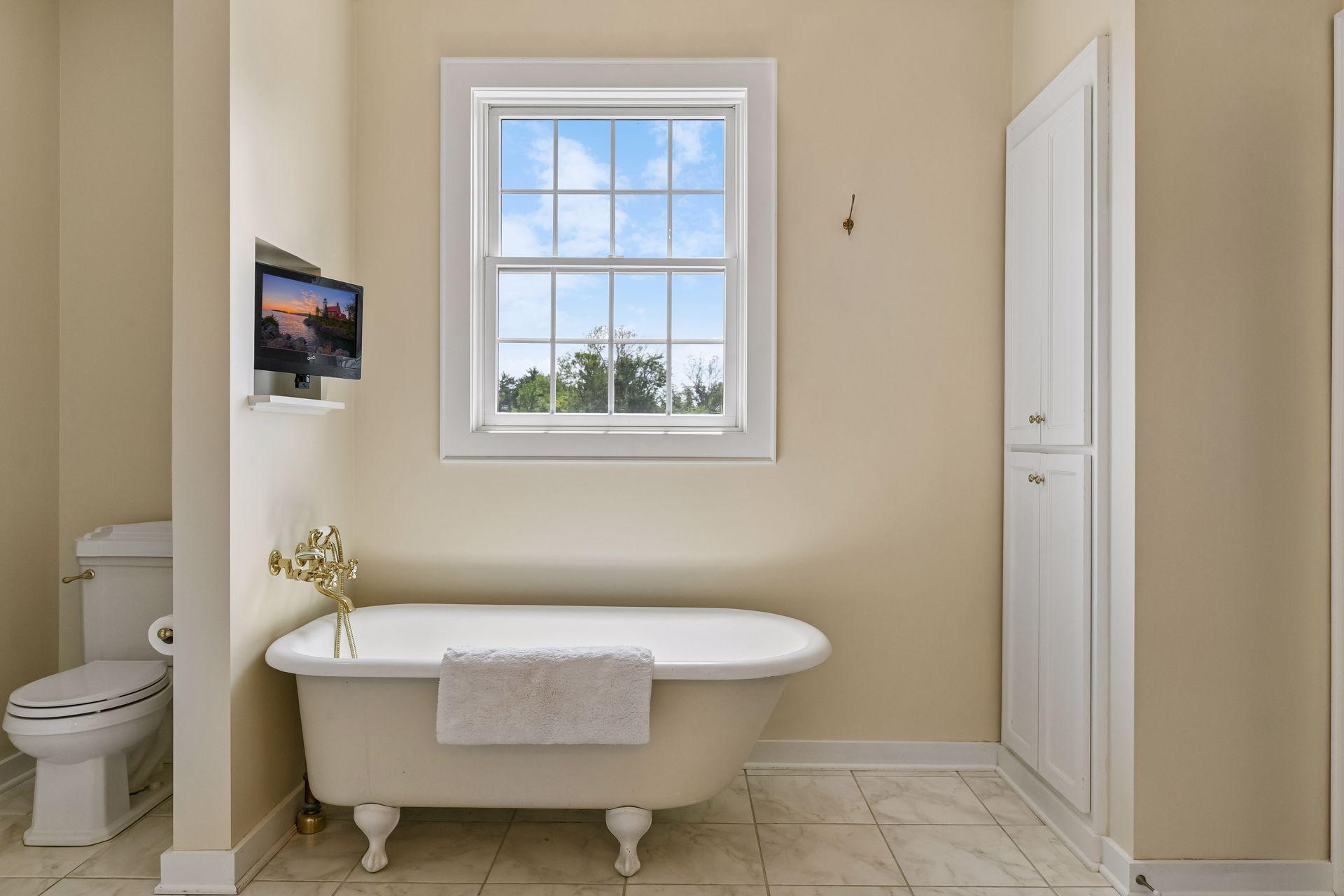 A timeless clawfoot bathtub is a charming addition to the Primary Bath.