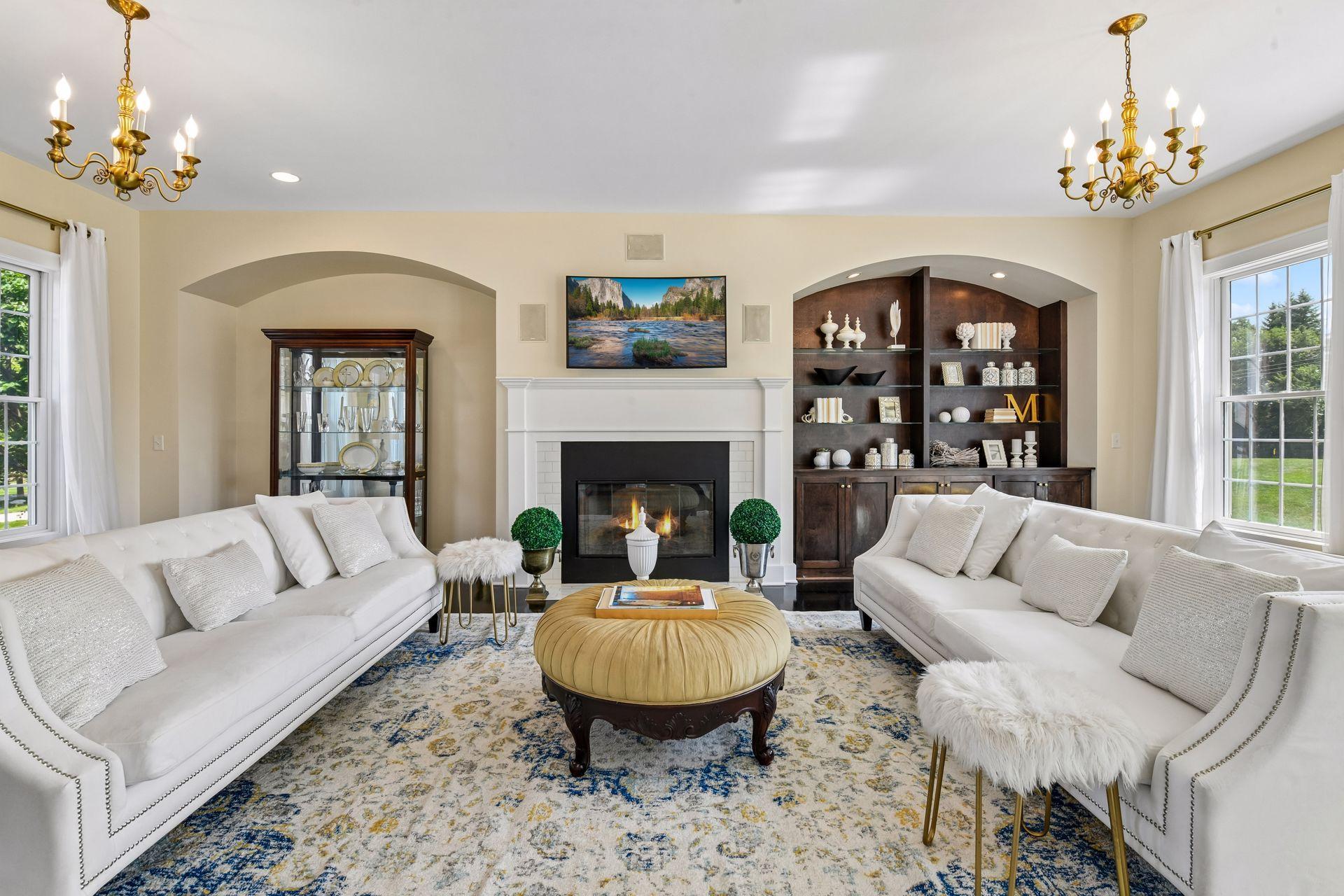 The sun-filled Family Room features an inviting gas fireplace and beautiful built-ins.