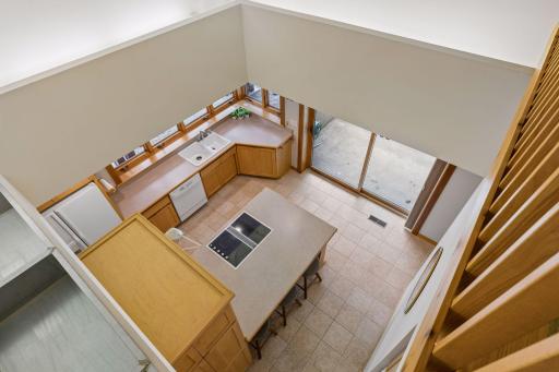 Open ceiling over the kitchen, viewable from the upstairs mezzanine and hallway