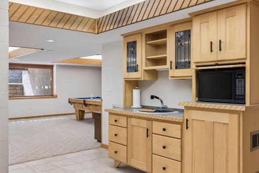 The cabinet on the lower right has space for a small refrigerator or wine cooler to be added