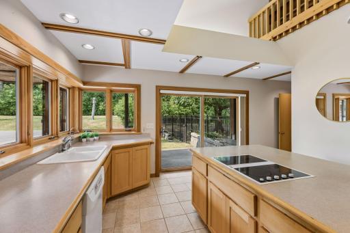 Tiled floors with maple cabinetry and millwork