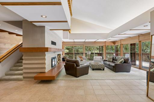 Recessed ceiling lighting. Stairway leading to upper level