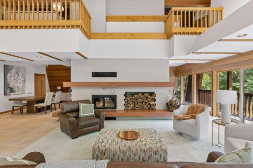 The living room has four large sliding glass doors in addition to other floor-to-ceiling windows for unobstructed viewing
