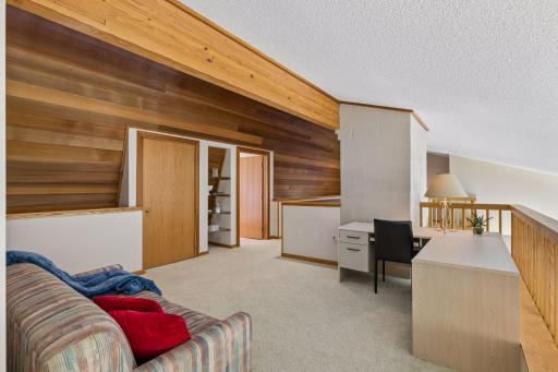 Large unfinished storage attic room through the door on the left, with a full bathroom to the right