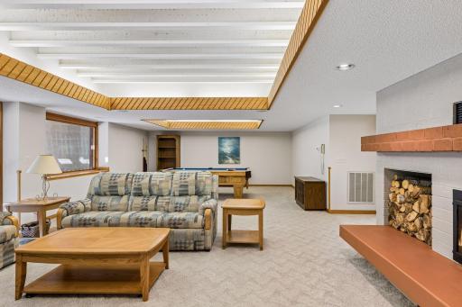 Lower-level recreation room for entertaining and access to the wet bar.