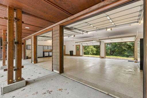 Large oversized garage 25 feet x 38' feet with 5 overhead garage doors and one exterior service door. Epoxied flooring.
