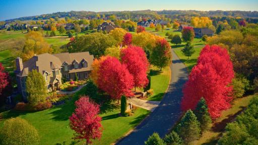 Troy Burne in the fall months, features mature tree-lined streets.
