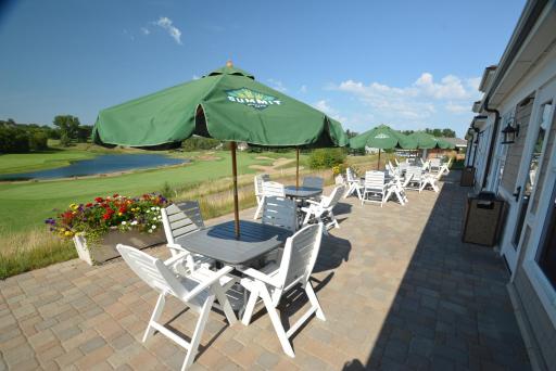 Clubhouse patio for lunch, dinner, and happy hour with a view of the golf course.