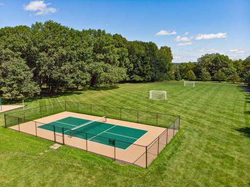 The private Pickleball court with fencing and a soccer field is for TBGV residents.