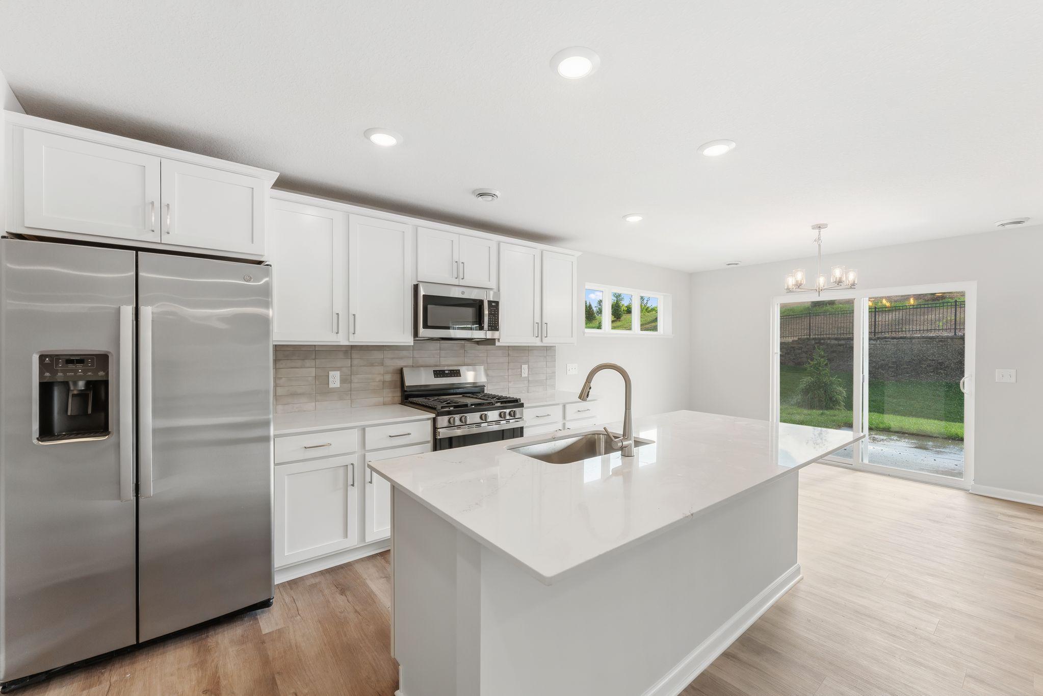 Home features quartz countertops, stainless steel GE appliances, soft close doors and drawers and more! (Photos are for representation only, colors and materials may vary in actual home.)