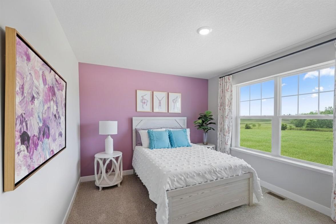 All three of the other upstairs bedrooms are large and feature walk-in closets!! Model photo, options and colors may vary.