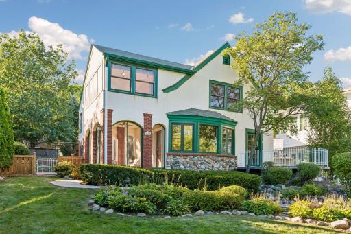 Striking Tudor-style exterior framed by mature landscaping and a manicured front garden