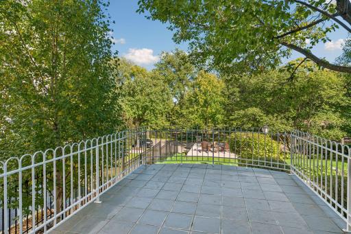 Elevated terrace overlooking the landscaped grounds, offering a private outdoor retreat.
