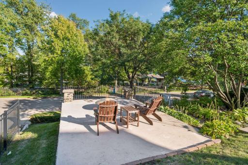 Spacious outdoor terrace designed for entertaining and enjoying the surrounding greenery.