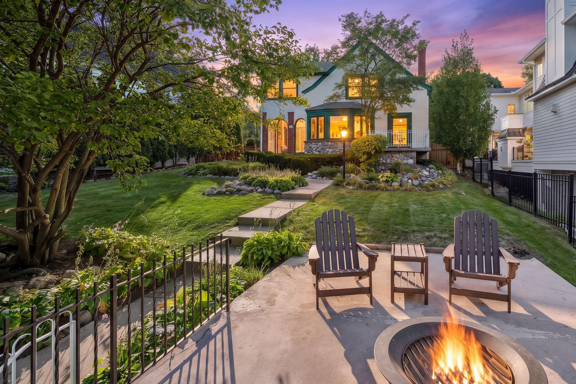 Twilight on Queenâbeautiful landscaping, a classic home, and an incredible Lake Harriet setting.