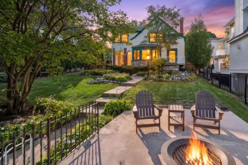 Twilight on Queenâbeautiful landscaping, a classic home, and an incredible Lake Harriet setting.