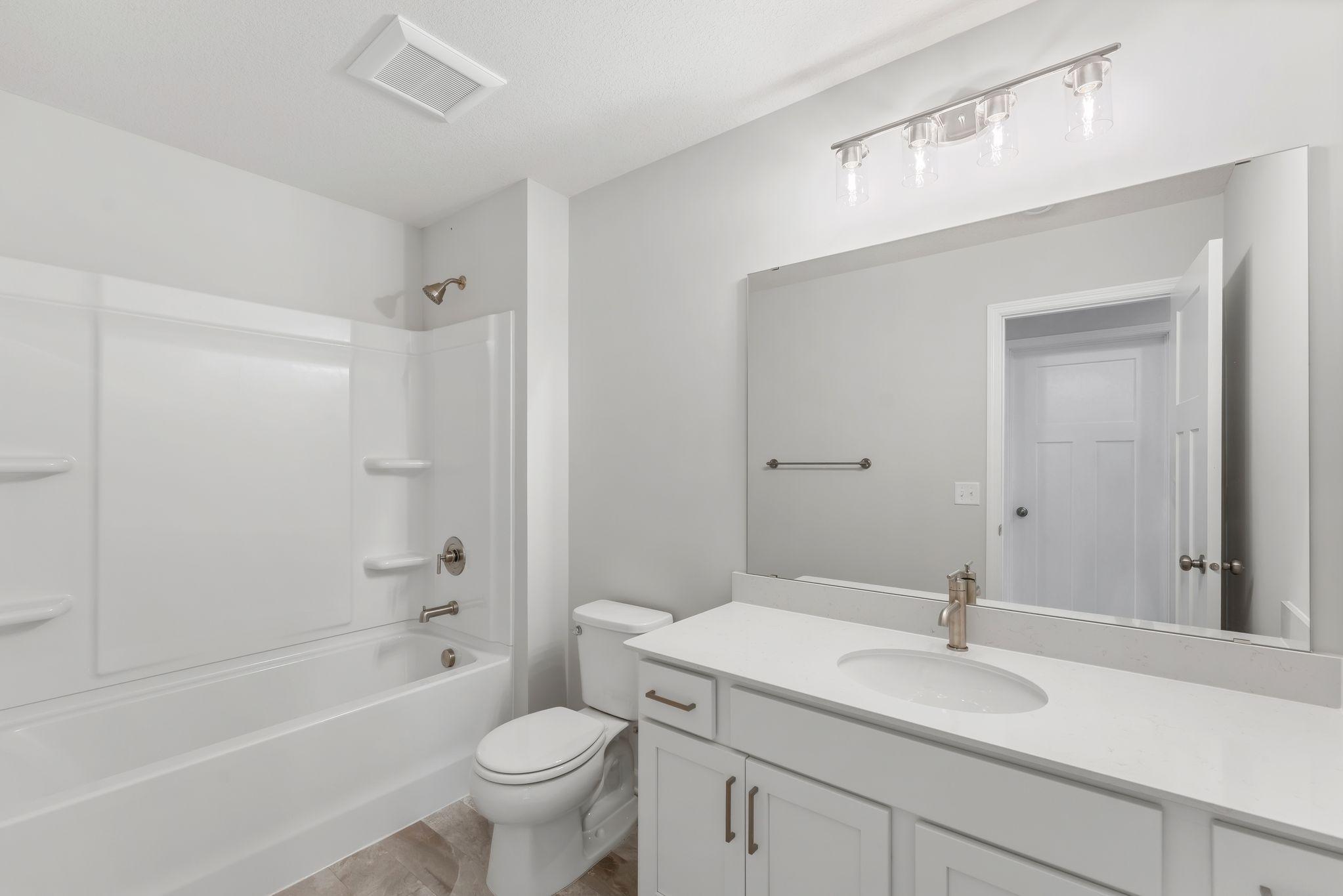 Additional upstairs bath has shower/tub combo and lots of counter space! (Pics are for representation only, colors and materials may vary in actual home.)