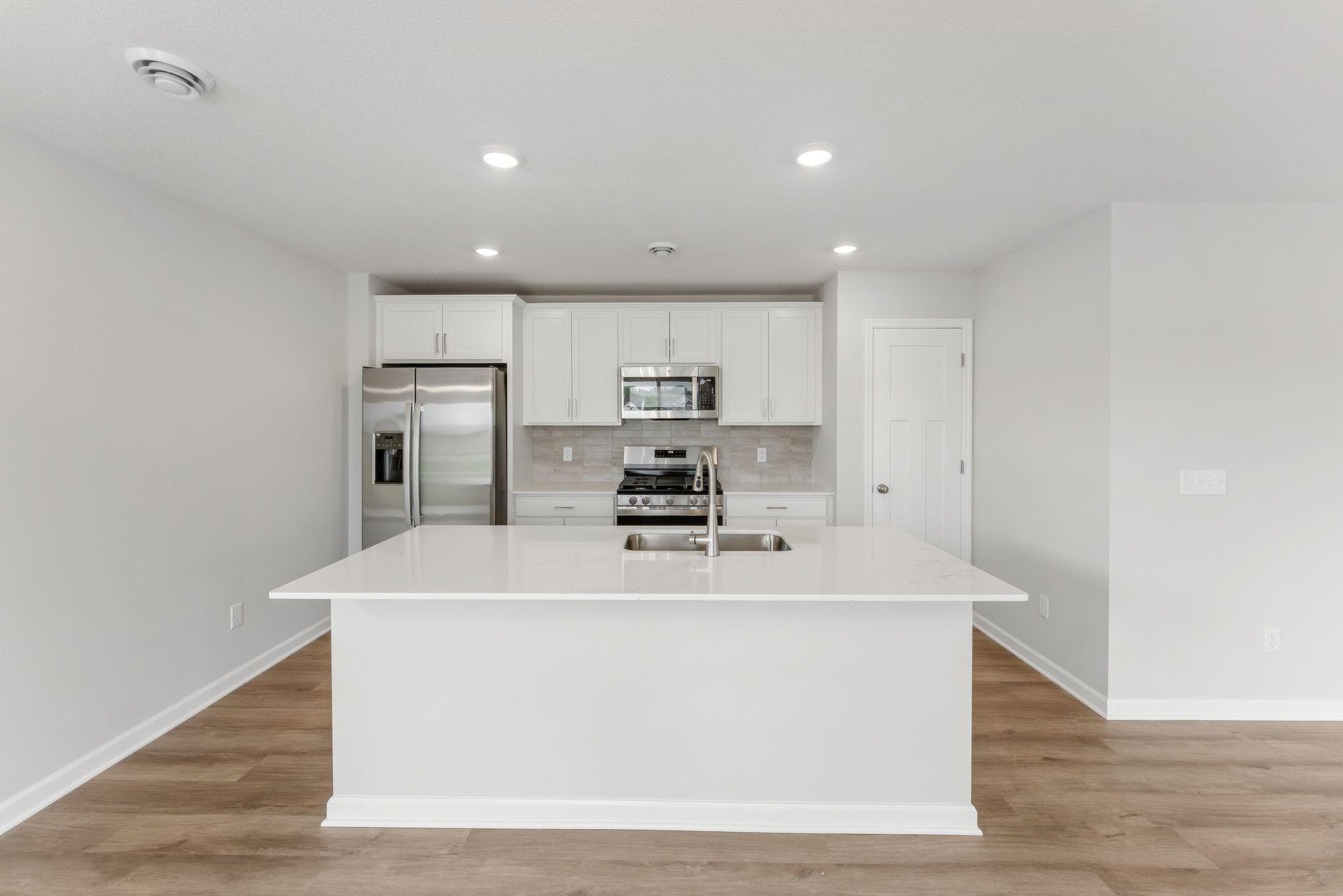 Entertain guests while you're cooking, prep meals on your durable quartz countertops with ample room for bar stools. (Pics are for representation only, colors and materials may vary in actual home.)