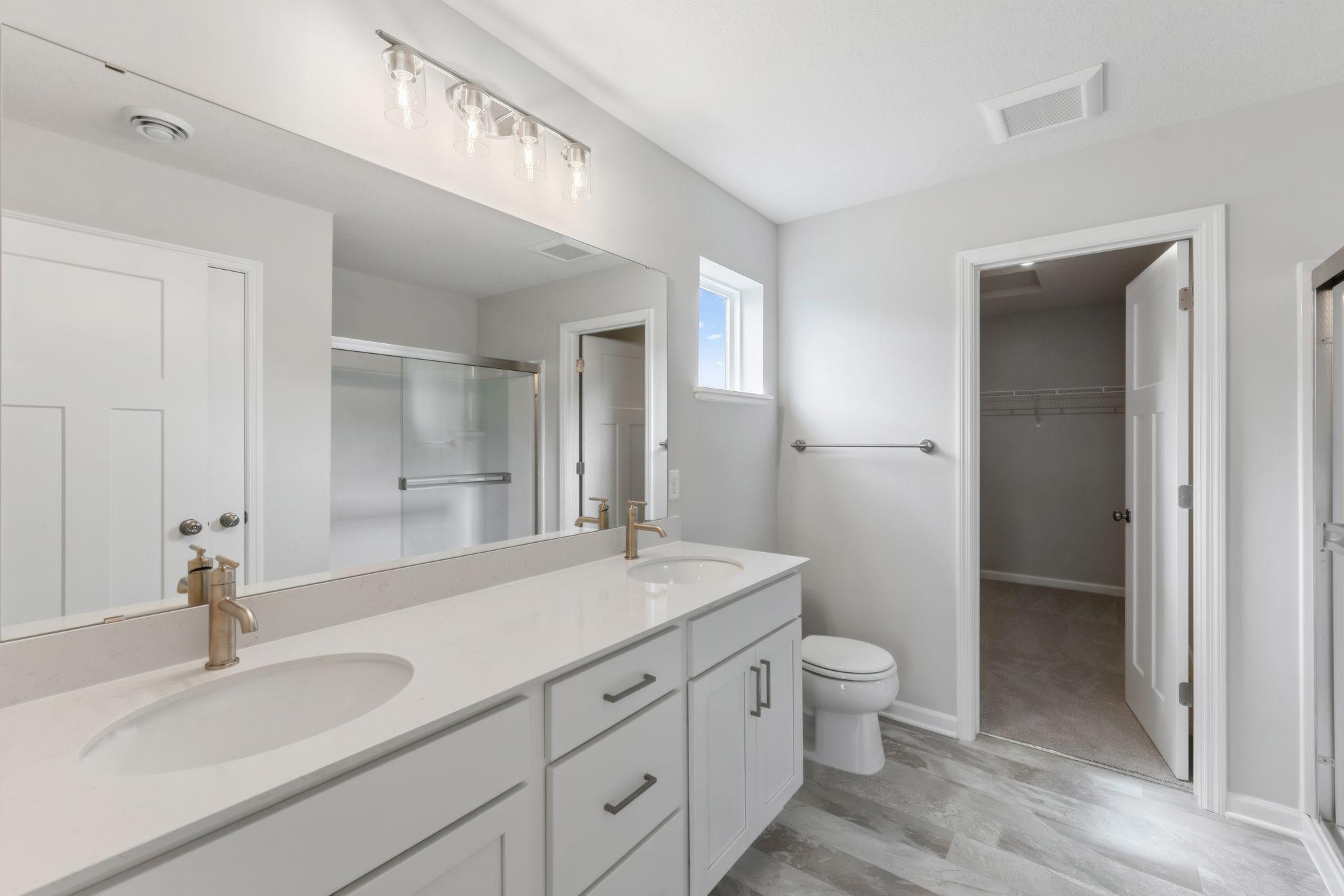 Get ready in your private en-suite bath with double sinks! (Pics are for representation only, colors and materials may vary in actual home.)