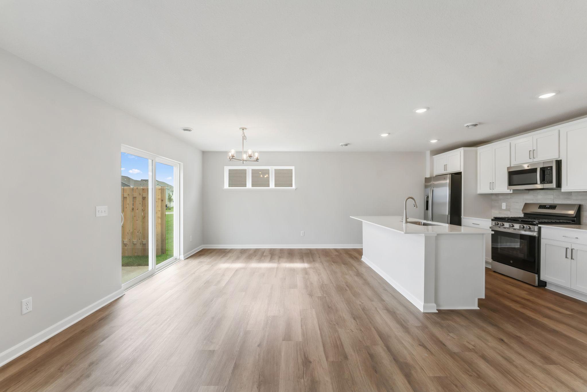 Open concept with lots of natural light from the patio door. (Pics are for representation only, colors and materials may vary in actual home.)
