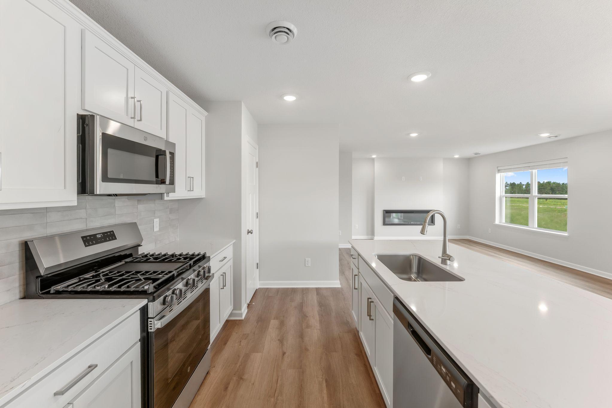 Amazing upgrades include GE appliances, microwave vents outside, tiled backsplash, soft close doors & drawers and more! (Pics are for representation only, colors and materials may vary in actual home.)