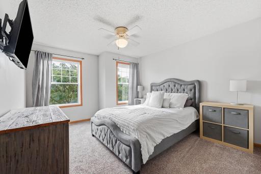 Primary Bedroom with a walk-in closet and access to the full bathroom.