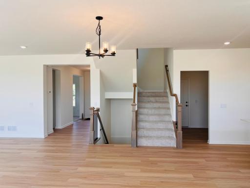 Stairs that lead up and down to completed basement