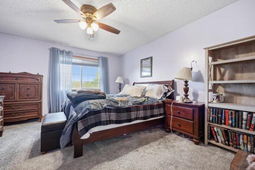 Primary Bedroom with custom California walk-in closet shelving