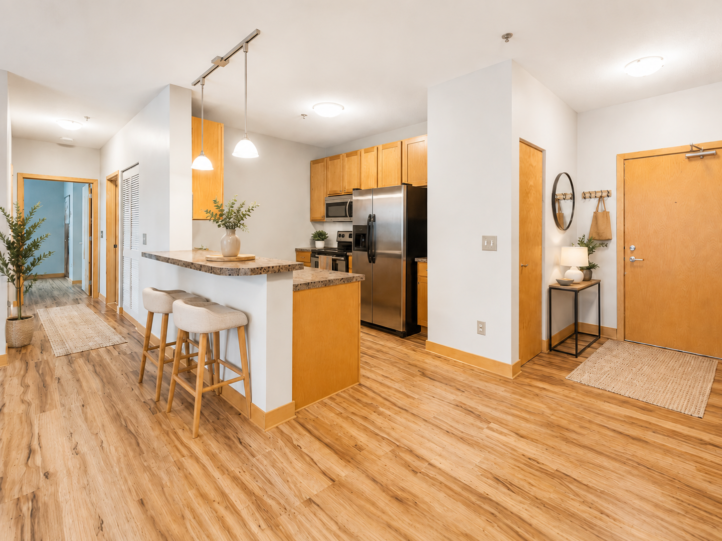Welcome home to your beautifully lit corner unit; with a designated coat closet that is open to the kitchen/dining and living room areas. Virtually staged