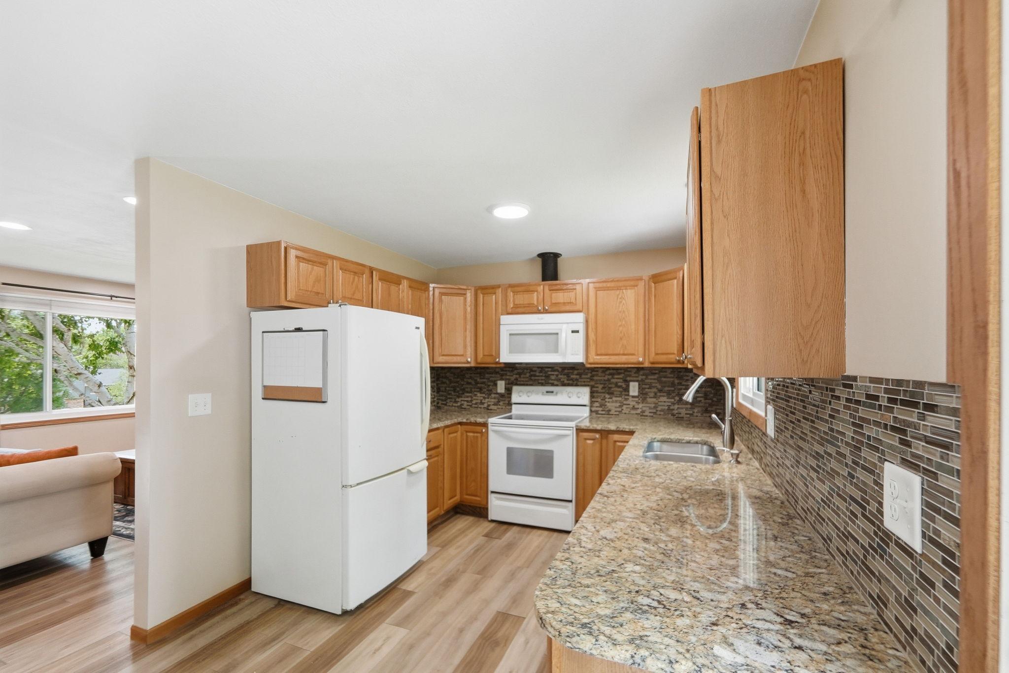 Kitchen with Granite Counter tops and backsplash