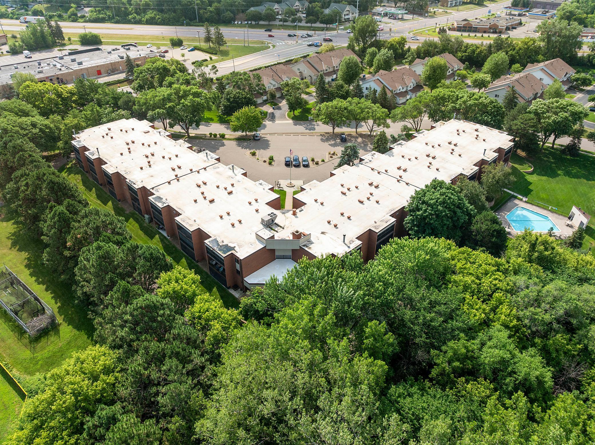 Note the large open parking lot at the front and the swimming pool discreetly placed at the rear.