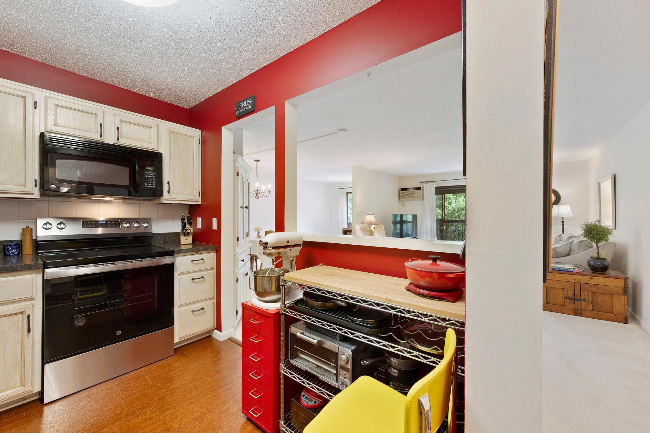 Ideal location in this spacious kitchen for informal dining or, in this case, a place to store all your cookware (seller's shelving units are not included in sale).