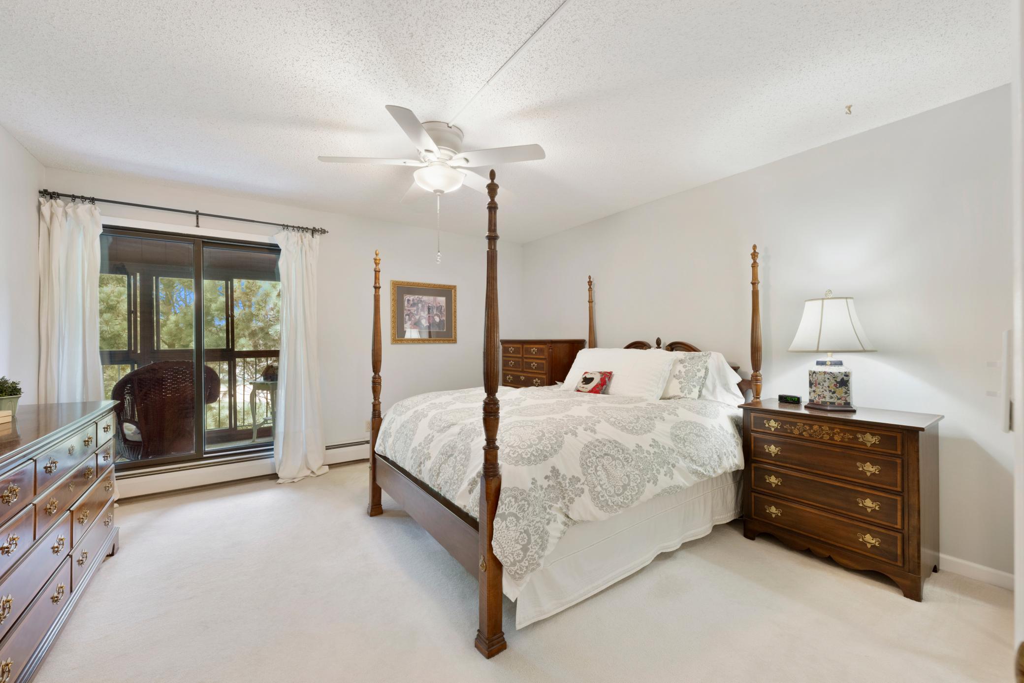13 x 13 bedroom large enough to fit a king-size bedroom set. Bonus: access to the serenity of the glass-enclosed/screened porch!