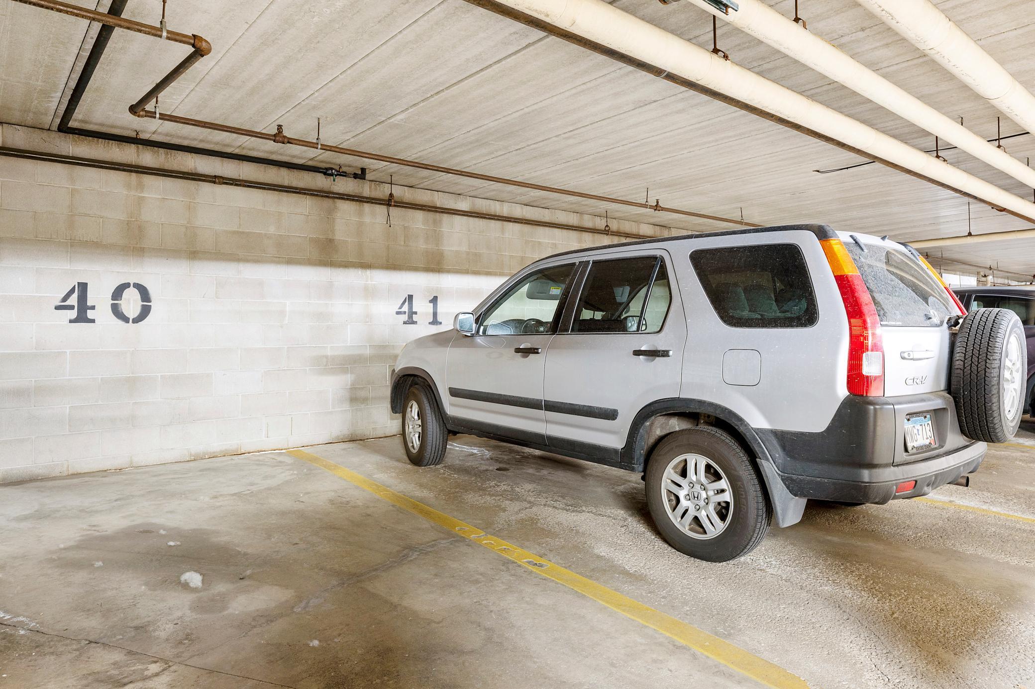 Parking space #41 is reserved for condo 301 in this large heated underground and secure parking garage.