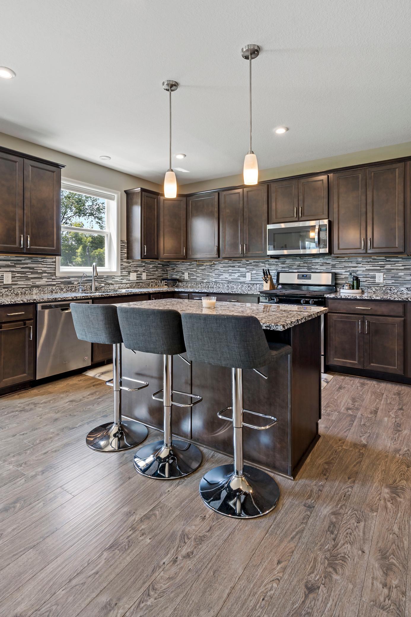 Stunning kitchen with window overlooking back yard and open concept to the entire main level.