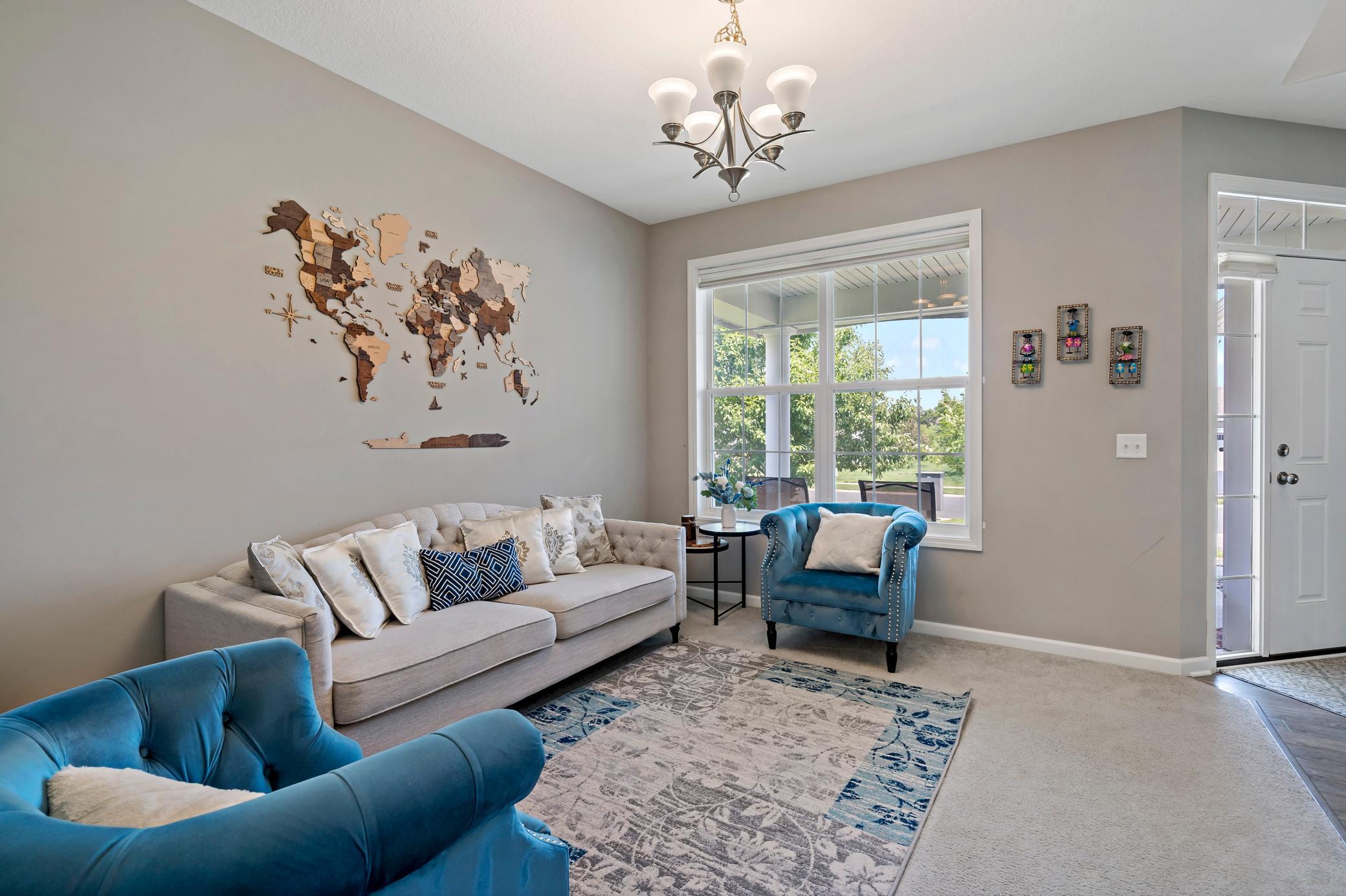 Living room at the front of the home is the perfect place to welcome guests for a visit. This space would also be perfect for a home office.