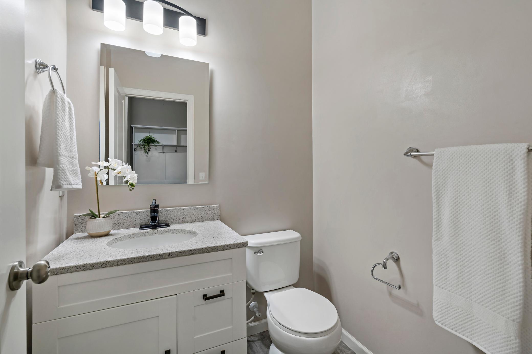 Main level 1/2 bath is conveniently located off the mud room.