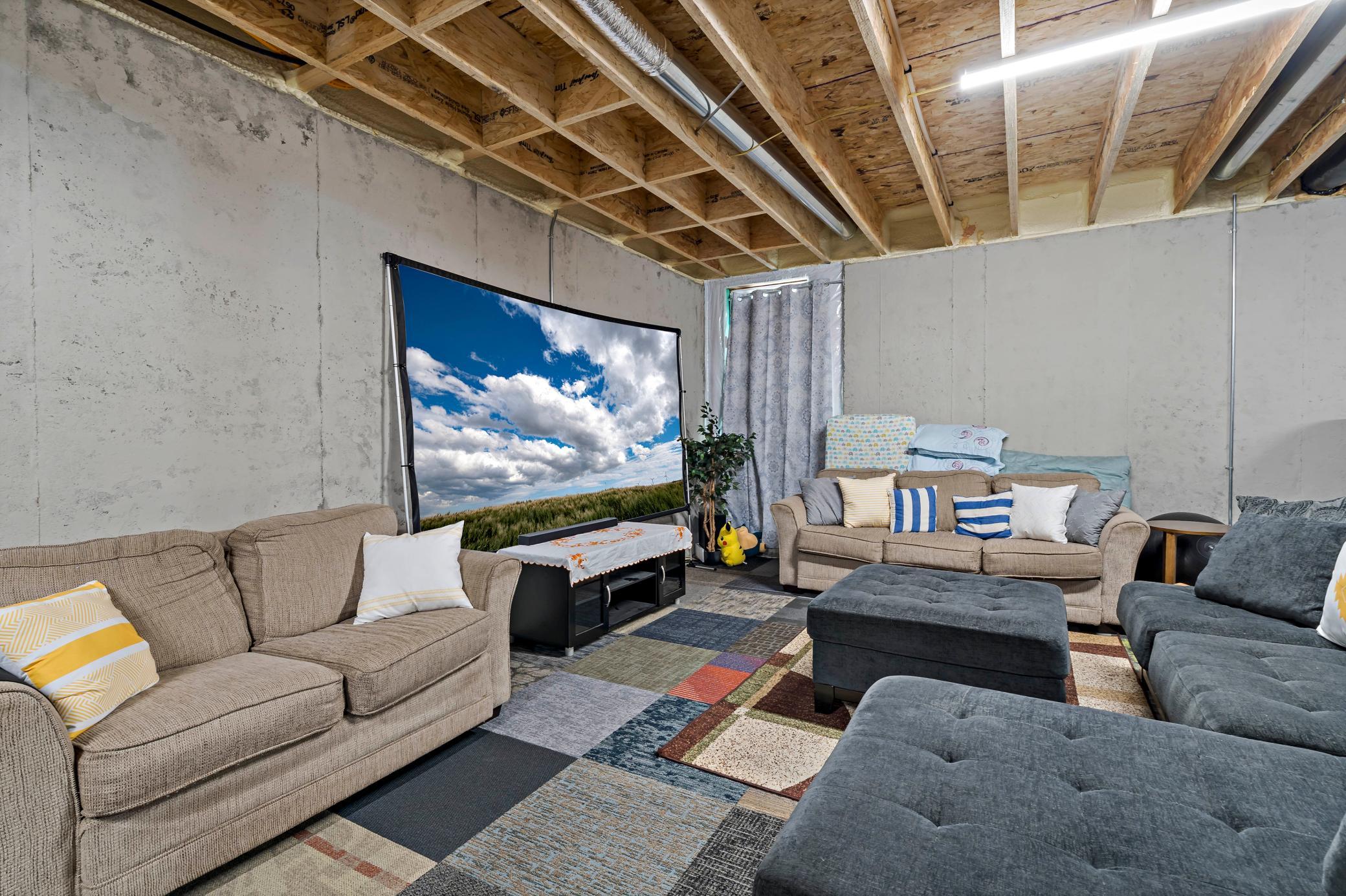 Lower level is unfinished and awaiting your creative touch.