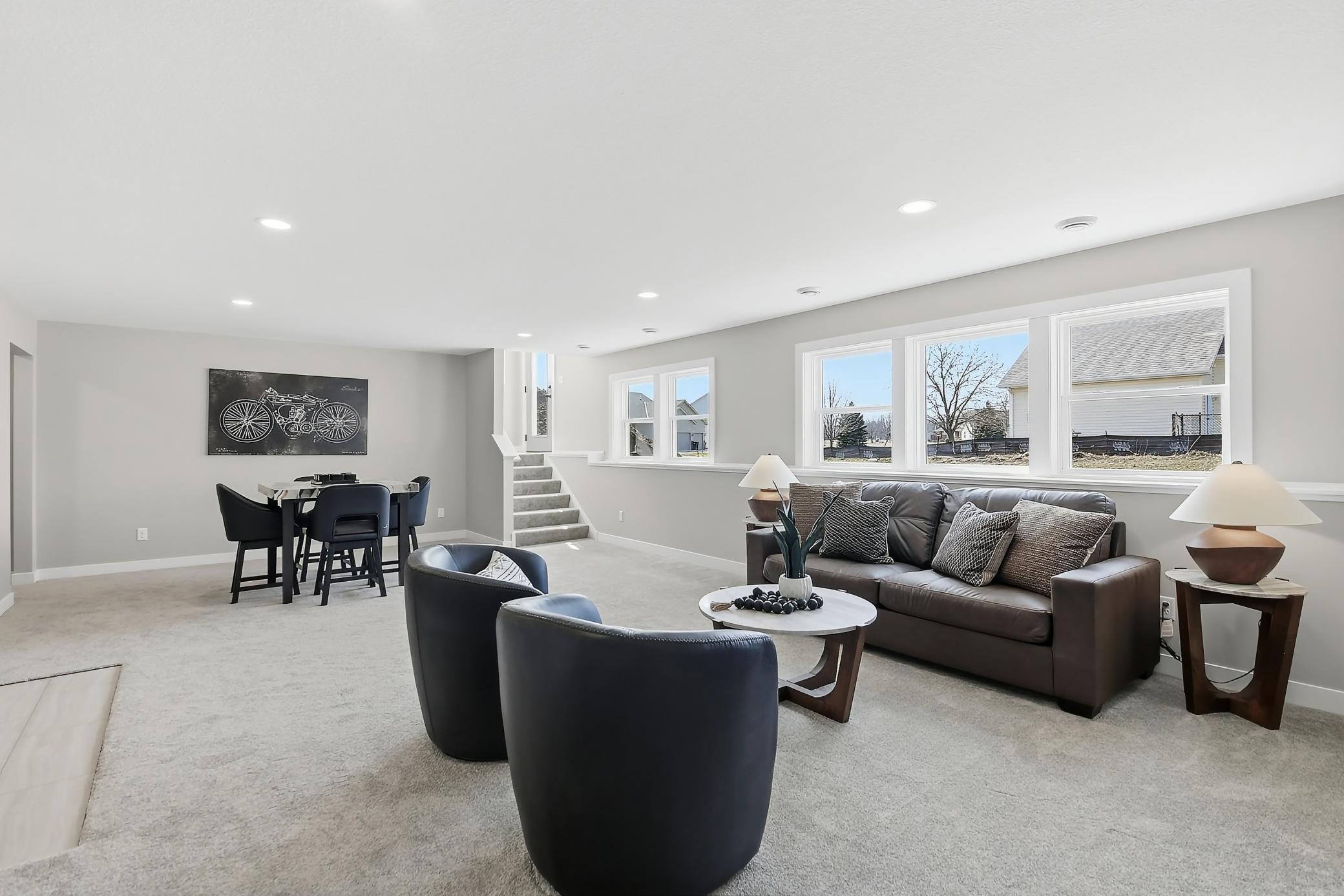 Lower level family room offers an abundance of windows, walk out to the back yard, easy access for entertainment or pets.