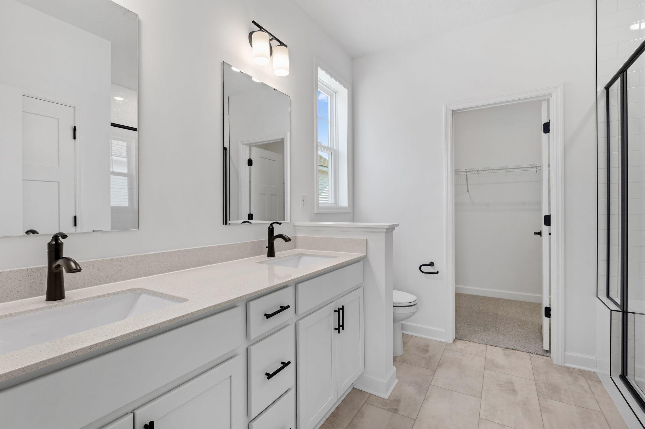 Convenient dual sinks promote a streamlined morning routine