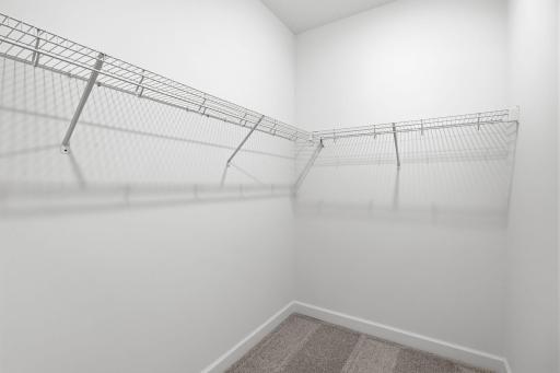 Fit for any fashion enthusiast, the walk-in closet offers ample wardrobe storage