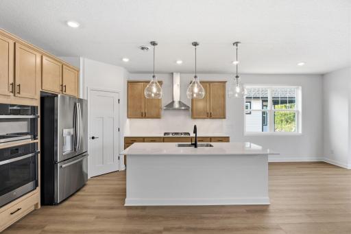 With plenty of cabinetry storage and a convenient corner pantry, everything is both within reach and out of sight at the same time