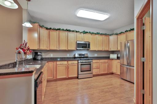 Custom Birch Cabinets, updated stainless appliances (past 10 years or so). Gas Range, new facet and Reverse Osmosis drinking water filtration system.