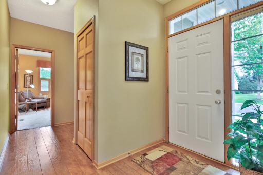 Foyer with hall coat closet. Custom closet organizers throughout the entire home.